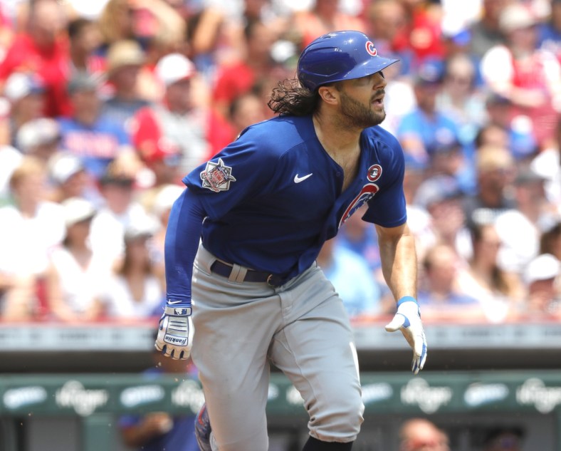 Jul 4, 2021; Cincinnati, Ohio, USA; Chicago Cubs center fielder Jake Marisnick (6) watches the ball after hitting a triple against the Cincinnati Reds during the second inning at Great American Ball Park. Mandatory Credit: David Kohl-USA TODAY Sports