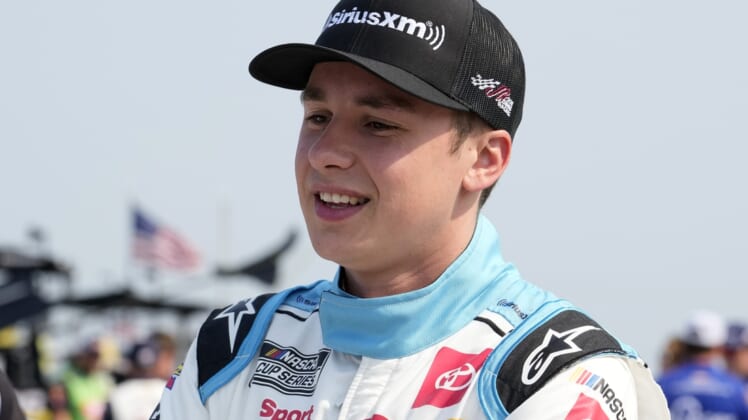 Jul 4, 2021; Elkhart Lake, Wisconsin, USA; NASCAR Cup Series driver Christopher Bell (20) before the Jockey Made in America 250 Presented by Kwik Trip at Road America. Mandatory Credit: Mike Dinovo-USA TODAY Sports