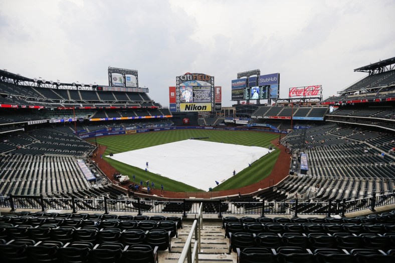 Jul 6, 2021; New York City, New York, USA; A general view with the tarp on the field prior to the game between the Milwaukee Brewers and the New York Mets at Citi Field. Mandatory Credit: Andy Marlin-USA TODAY Sports
