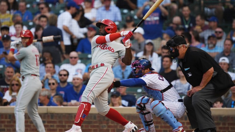 Jul 6, 2021; Chicago, Illinois, USA; Philadelphia Phillies left fielder Andrew McCutchen (22) watches his grand slam in the first inning against the Chicago Cubs at Wrigley Field. Mandatory Credit: Quinn Harris-USA TODAY Sports