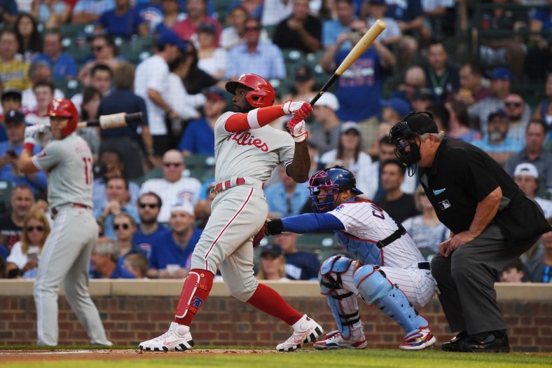 Jul 6, 2021; Chicago, Illinois, USA; Philadelphia Phillies left fielder Andrew McCutchen (22) watches his grand slam in the first inning against the Chicago Cubs at Wrigley Field. Mandatory Credit: Quinn Harris-USA TODAY Sports