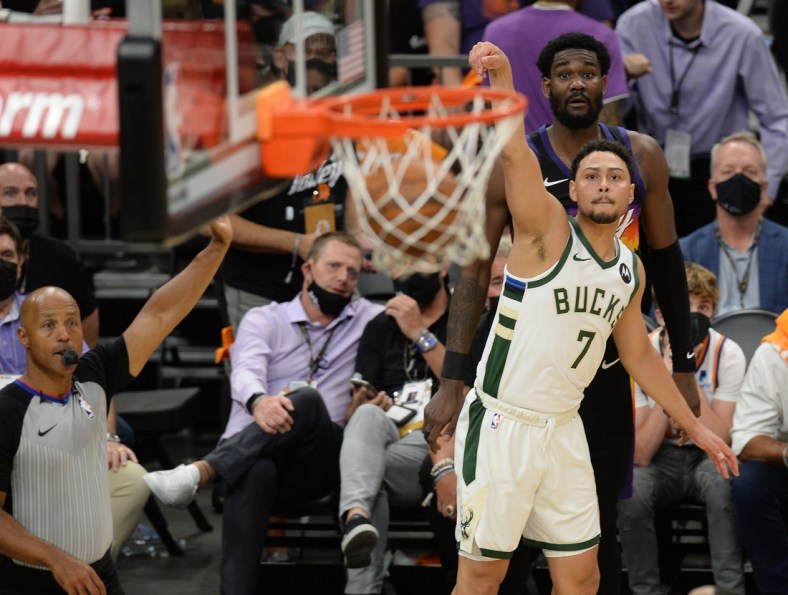 Jul 6, 2021; Phoenix, Arizona, USA; Milwaukee Bucks guard Bryn Forbes (7) makes a three point basket against the Phoenix Suns during the second half in game one of the 2021 NBA Finals at Phoenix Suns Arena. Mandatory Credit: Joe Camporeale-USA TODAY Sports