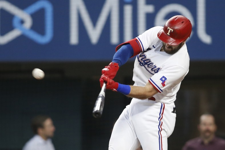 Jul 7, 2021; Arlington, Texas, USA; Texas Rangers right fielder Joey Gallo (13) hits a home run in the fourth inning against the Detroit Tigers at Globe Life Field. Mandatory Credit: Tim Heitman-USA TODAY Sports