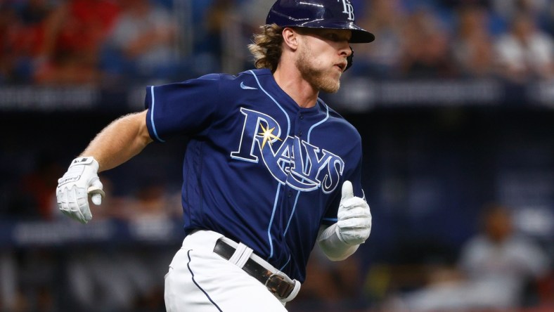 Jul 7, 2021; St. Petersburg, Florida, USA; Tampa Bay Rays shortstop Taylor Walls (6) runs to first base after hitting an RBI single in the second inning against the Cleveland Indians at Tropicana Field. Mandatory Credit: Nathan Ray Seebeck-USA TODAY Sports