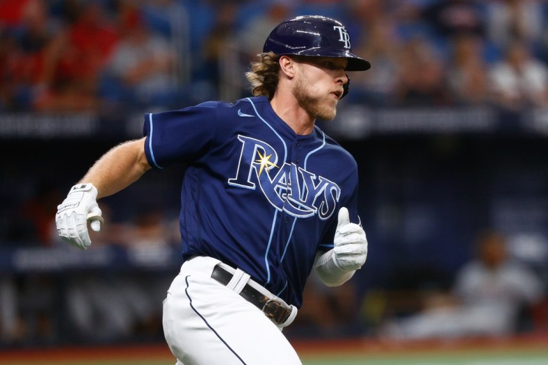 Jul 7, 2021; St. Petersburg, Florida, USA; Tampa Bay Rays shortstop Taylor Walls (6) runs to first base after hitting an RBI single in the second inning against the Cleveland Indians at Tropicana Field. Mandatory Credit: Nathan Ray Seebeck-USA TODAY Sports