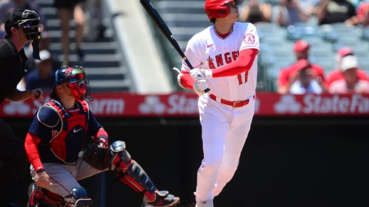 Jul 7, 2021; Anaheim, California, USA; Los Angeles Angels designated hitter Shohei Ohtani (17) hits a single against the Boston Red Sox during the first inning at Angel Stadium. Mandatory Credit: Gary A. Vasquez-USA TODAY Sports