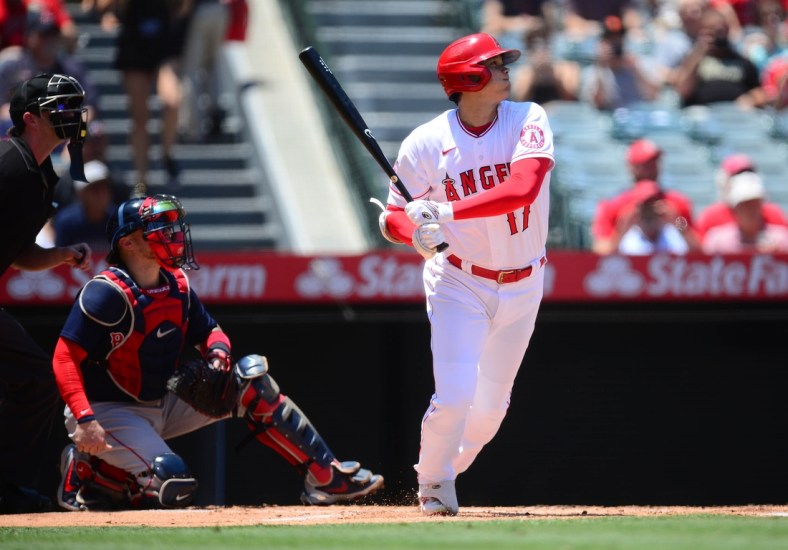 Jul 7, 2021; Anaheim, California, USA; Los Angeles Angels designated hitter Shohei Ohtani (17) hits a single against the Boston Red Sox during the first inning at Angel Stadium. Mandatory Credit: Gary A. Vasquez-USA TODAY Sports