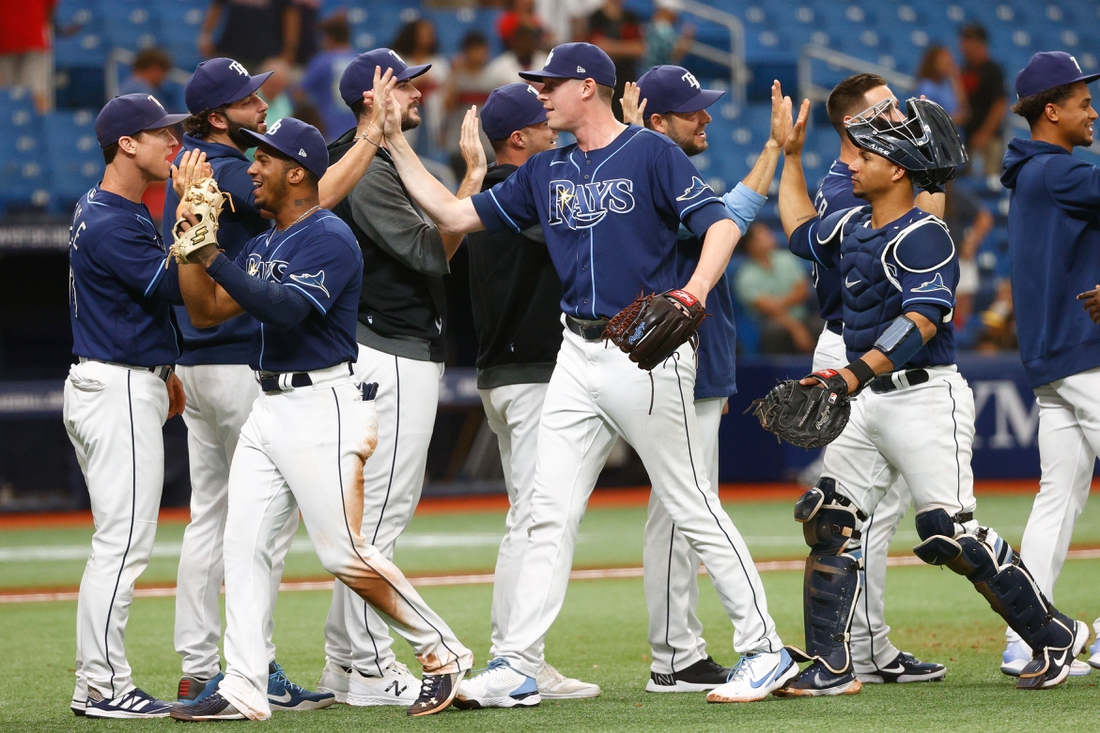 Jul 7, 2021; St. Petersburg, Florida, USA; Tampa Bay Rays relief pitcher Pete Fairbanks (29) celebrates with teammates after defeating the Cleveland Indians at Tropicana Field. Mandatory Credit: Nathan Ray Seebeck-USA TODAY Sports