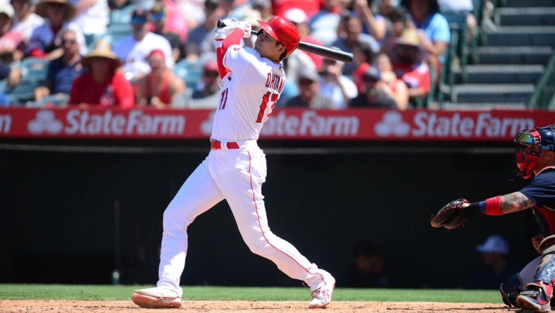 Jul 7, 2021; Anaheim, California, USA; Los Angeles Angels designated hitter Shohei Ohtani (17) hits a solo home run against the Boston Red Sox during the fifth inning at Angel Stadium. Mandatory Credit: Gary A. Vasquez-USA TODAY Sports