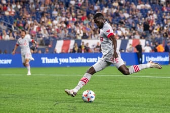 Jul 7, 2021; Foxborough, Massachusetts, USA; Toronto FC defender Kemar Lawrence (92) scores a goal during the first half against the New England Revolution at Gillette Stadium. Mandatory Credit: Paul Rutherford-USA TODAY Sports