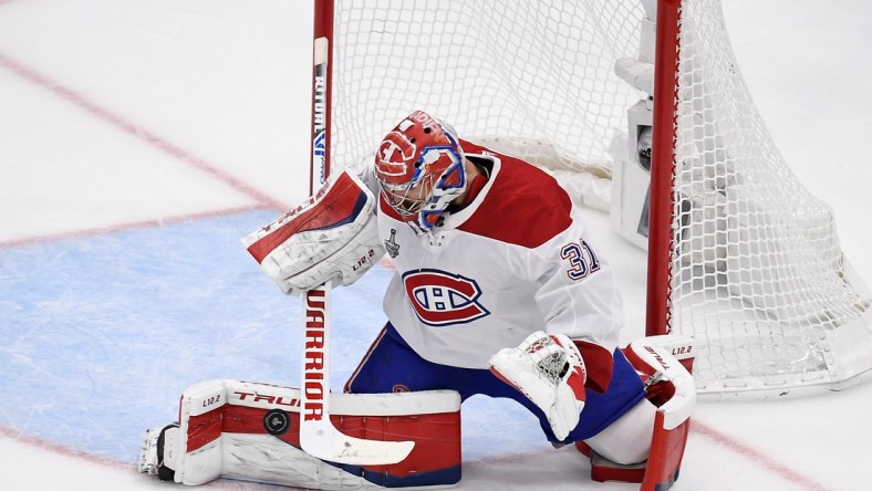 Jul 7, 2021; Tampa, Florida, USA; Montreal Canadiens goaltender Carey Price (31) makes a save against the Tampa Bay Lightning during the first period in game five of the 2021 Stanley Cup Final at Amalie Arena. Mandatory Credit: Douglas DeFelice-USA TODAY Sports