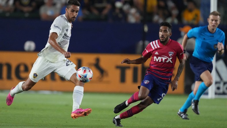 Jul 7, 2021; Carson, California, USA; LA Galaxy forward Ethan Zubak (29) moves the ball against FC Dallas forward Jesus Ferreira (9) during the first half at Dignity Health Park. Mandatory Credit: Kirby Lee-USA TODAY Sports