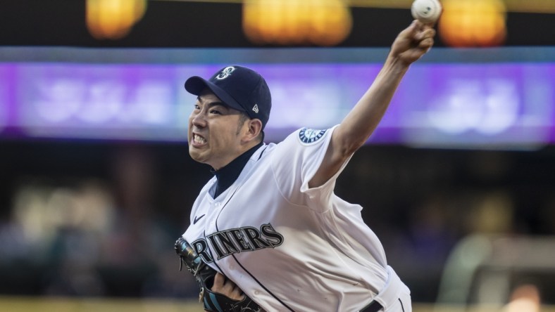 Jul 7, 2021; Seattle, Washington, USA; Seattle Mariners Yusei Kikuchi (18) pitches during the first inning against the New York Yankees at T-Mobile Park. Mandatory Credit: Stephen Brashear-USA TODAY Sports