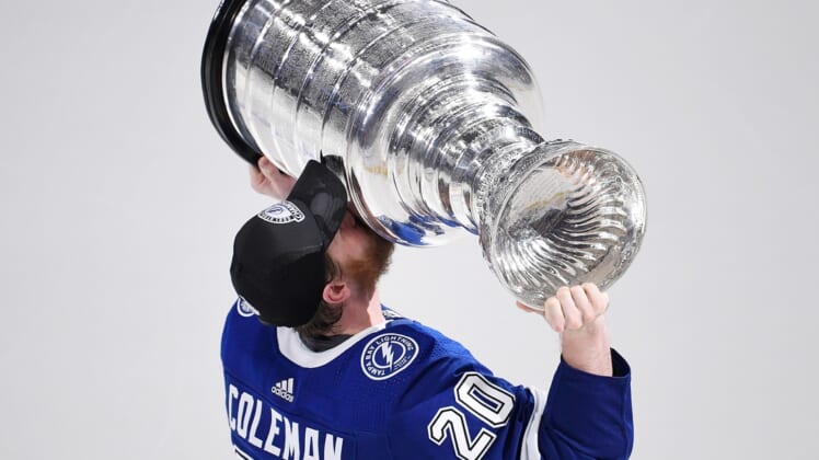 Jul 7, 2021; Tampa, Florida, USA; Tampa Bay Lightning center Blake Coleman (20) kisses the Stanley Cup after the Lightning defeated the Montreal Canadiens 1-0 in game five to win the 2021 Stanley Cup Final at Amalie Arena. Mandatory Credit: Douglas DeFelice-USA TODAY Sports