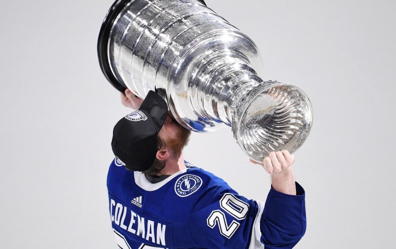 Jul 7, 2021; Tampa, Florida, USA; Tampa Bay Lightning center Blake Coleman (20) kisses the Stanley Cup after the Lightning defeated the Montreal Canadiens 1-0 in game five to win the 2021 Stanley Cup Final at Amalie Arena. Mandatory Credit: Douglas DeFelice-USA TODAY Sports