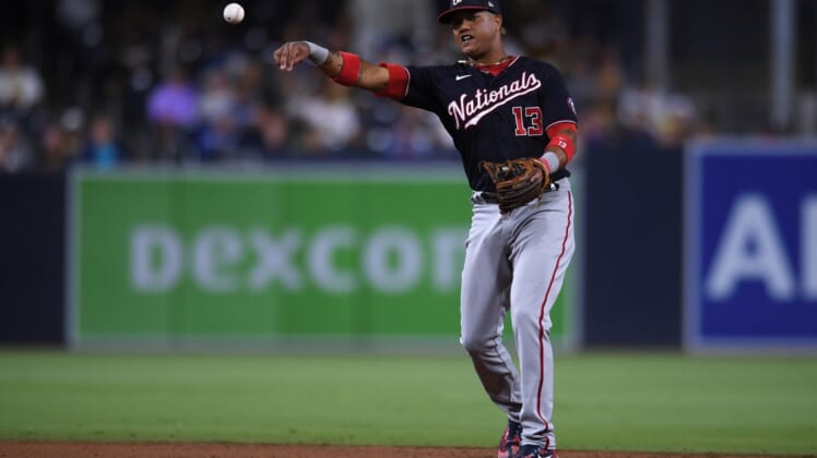 Jul 7, 2021; San Diego, California, USA; Washington Nationals third baseman Starlin Castro (13) throws to first base during the eighth inning against the San Diego Padres at Petco Park. Mandatory Credit: Orlando Ramirez-USA TODAY Sports