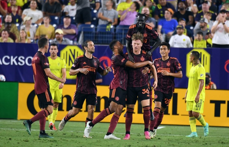 Jul 8, 2021; Nashville, TN, USA; Atlanta United forward Jackson Conway (36) celebrates with teammates after a goal to tie the game during the second half against the Nashville SC at Nissan Stadium. Mandatory Credit: Christopher Hanewinckel-USA TODAY Sports