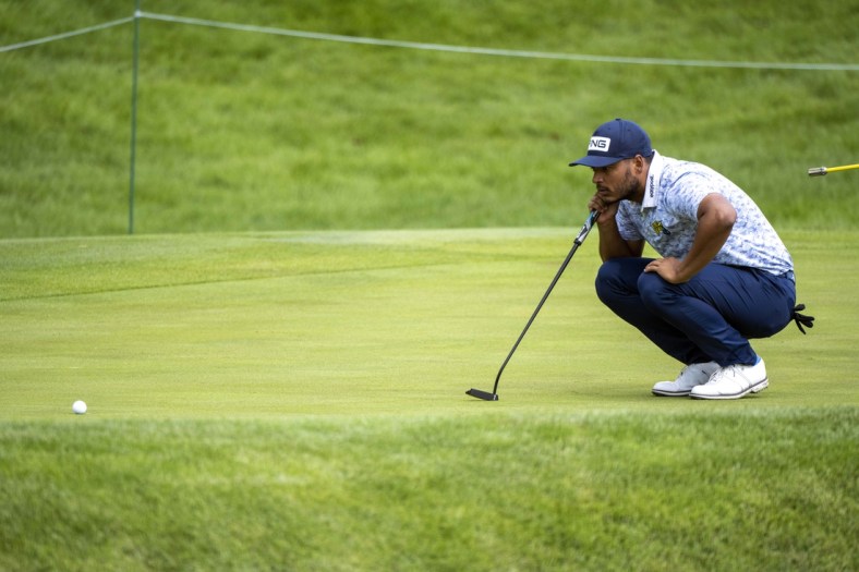 Jul 9, 2021; Silvis, Illinois, USA; Sebastian Munoz lines up his putt on the 17th hole during the second round of the John Deere Classic golf tournament. Mandatory Credit: Marc Lebryk-USA TODAY Sports