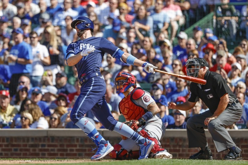 Jul 9, 2021; Chicago, Illinois, USA; Chicago Cubs third baseman Kris Bryant (17) hits a three-run double against the St. Louis Cardinals during the seventh inning at Wrigley Field. Mandatory Credit: Kamil Krzaczynski-USA TODAY Sports