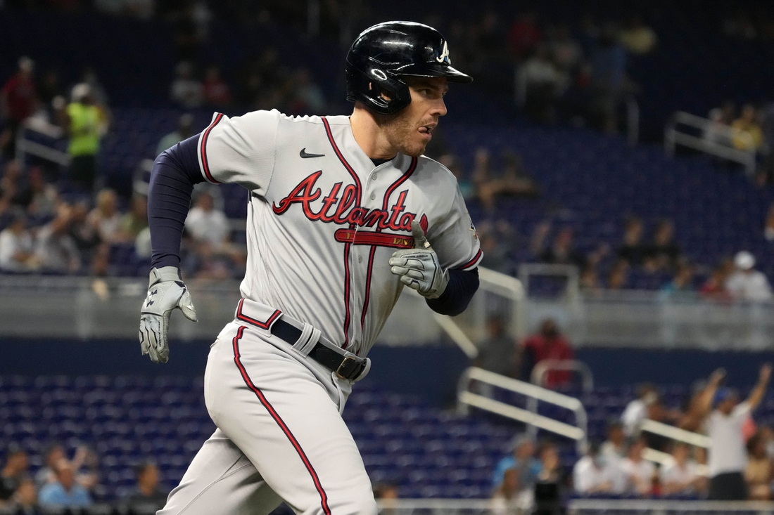 Jul 9, 2021; Miami, Florida, USA; Atlanta Braves first baseman Freddie Freeman (5) rounds the bases after hitting a solo homerun in the 1st inning against the Miami Marlins at loanDepot park. Mandatory Credit: Jasen Vinlove-USA TODAY Sports