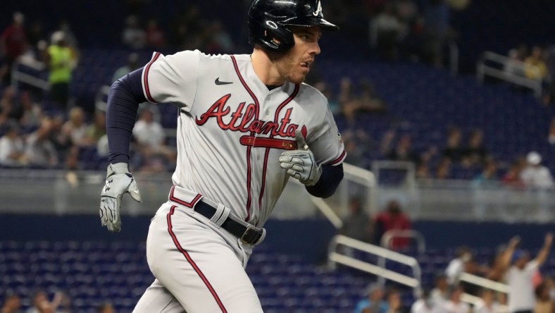 Jul 9, 2021; Miami, Florida, USA; Atlanta Braves first baseman Freddie Freeman (5) rounds the bases after hitting a solo homerun in the 1st inning against the Miami Marlins at loanDepot park. Mandatory Credit: Jasen Vinlove-USA TODAY Sports