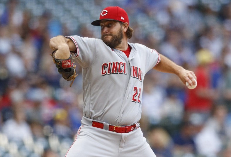 Jul 9, 2021; Milwaukee, Wisconsin, USA;  Cincinnati Reds pitcher Wade Miley (22) throws a pitch during the first inning against the Cincinnati Reds at American Family Field. Mandatory Credit: Jeff Hanisch-USA TODAY Sports