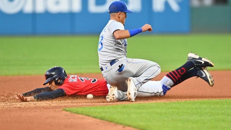 Jul 9, 2021; Cleveland, Ohio, USA; Cleveland Indians left fielder Oscar Mercado (35) slides into second base on a stolen base as Kansas City Royals shortstop Nicky Lopez (8) can not handle the throw during the seventh inning at Progressive Field. Mandatory Credit: Ken Blaze-USA TODAY Sports