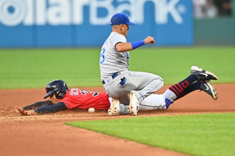 Jul 9, 2021; Cleveland, Ohio, USA; Cleveland Indians left fielder Oscar Mercado (35) slides into second base on a stolen base as Kansas City Royals shortstop Nicky Lopez (8) can not handle the throw during the seventh inning at Progressive Field. Mandatory Credit: Ken Blaze-USA TODAY Sports