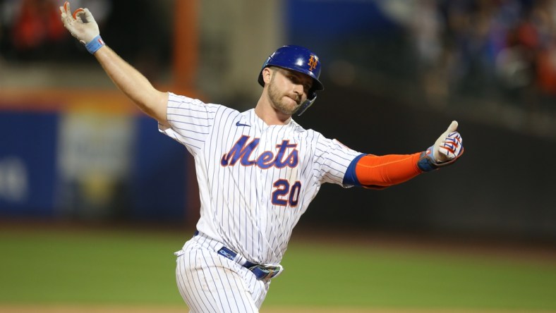 Jul 9, 2021; New York City, New York, USA; New York Mets first baseman Pete Alonso (20) reacts as he rounds the bases after hitting a three-run home run against the Pittsburgh Pirates during the sixth inning at Citi Field. Mandatory Credit: Brad Penner-USA TODAY Sports