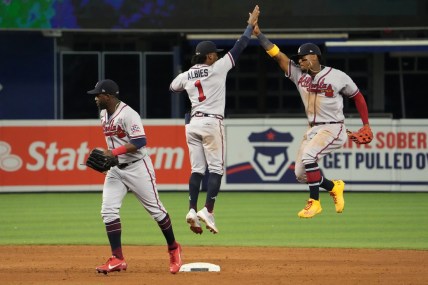 Jul 9, 2021; Miami, Florida, USA; Atlanta Braves second baseman Ozzie Albies (1) and right fielder Ronald Acuna Jr. (13) celebrate after defeating the Miami Marlins at loanDepot park. Mandatory Credit: Jasen Vinlove-USA TODAY Sports