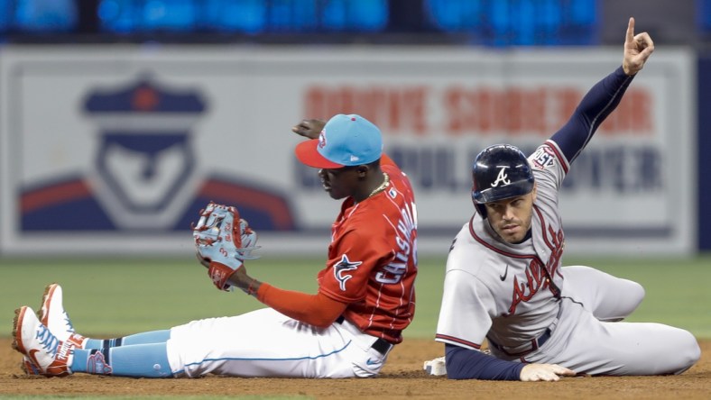 Jul 10, 2021; Miami, Florida, USA; Atlanta Braves first baseman Freddie Freeman (5) reacts from second base during the third inning against Miami Marlins second baseman Jazz Chisholm Jr. (2) at loanDepot Park. Mandatory Credit: Sam Navarro-USA TODAY Sports