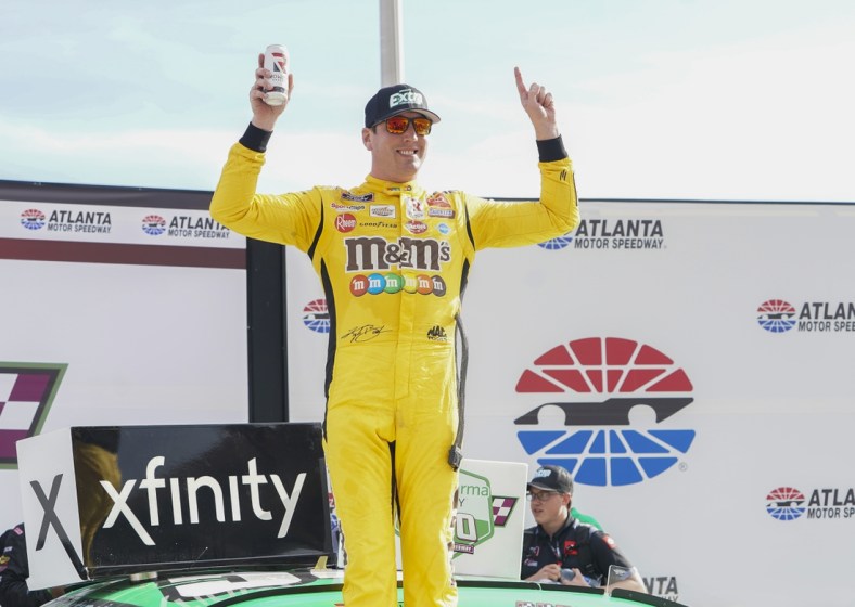 Jul 10, 2021; Hampton, GA, USA; NASCAR Xfinity Series driver Kyle Busch (54) celebrates after winning the Credit Karma 250 at Atlanta Motor Speedway. Mandatory Credit: Marvin Gentry-USA TODAY Sports