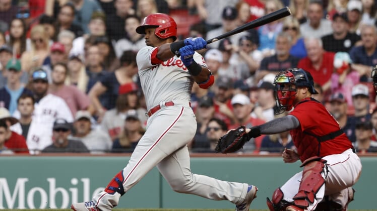 Jul 10, 2021; Boston, Massachusetts, USA; Philadelphia Phillies shortstop Jean Segura (2) hits a two run single against the Boston Red Sox during the eighth inning at Fenway Park. Mandatory Credit: Winslow Townson-USA TODAY Sports