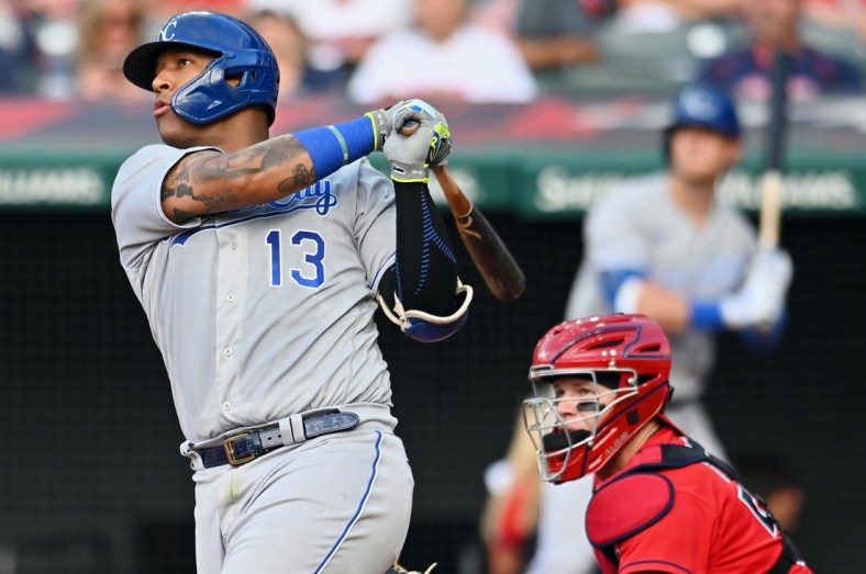 Jul 10, 2021; Cleveland, Ohio, USA; Kansas City Royals catcher Salvador Perez (13) hits a home run against the Cleveland Indians during the fourth inning at Progressive Field. Mandatory Credit: Ken Blaze-USA TODAY Sports