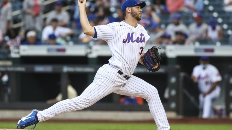 Jul 10, 2021; New York City, New York, USA;  New York Mets pitcher Tylor Megill (38) pitches against the Pittsburgh Pirates in the first inning at Citi Field. Mandatory Credit: Wendell Cruz-USA TODAY Sports