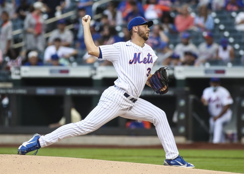 Jul 10, 2021; New York City, New York, USA;  New York Mets pitcher Tylor Megill (38) pitches against the Pittsburgh Pirates in the first inning at Citi Field. Mandatory Credit: Wendell Cruz-USA TODAY Sports