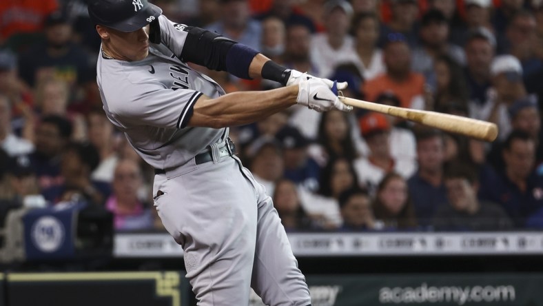 Jul 10, 2021; Houston, Texas, USA; New York Yankees right fielder Aaron Judge (99) hits a home run against the Houston Astros during the third inning at Minute Maid Park. Mandatory Credit: Troy Taormina-USA TODAY Sports