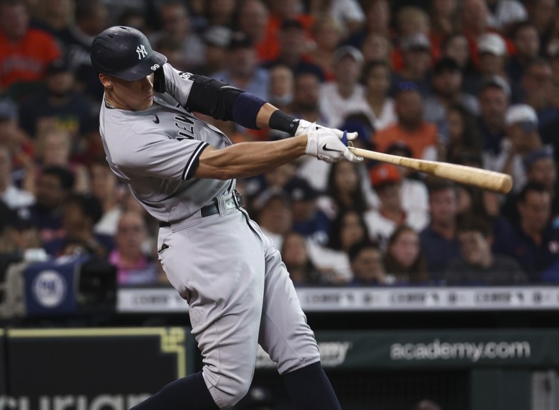 Jul 10, 2021; Houston, Texas, USA; New York Yankees right fielder Aaron Judge (99) hits a home run against the Houston Astros during the third inning at Minute Maid Park. Mandatory Credit: Troy Taormina-USA TODAY Sports