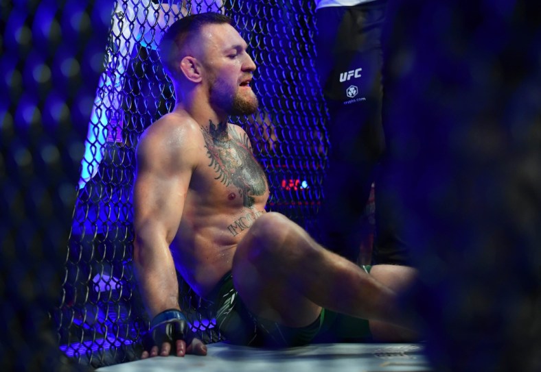 Jul 10, 2021; Las Vegas, Nevada, USA; Conor McGregor reacts following an injury suffered against Dustin Poirier during UFC 264 at T-Mobile Arena. Mandatory Credit: Gary A. Vasquez-USA TODAY Sports