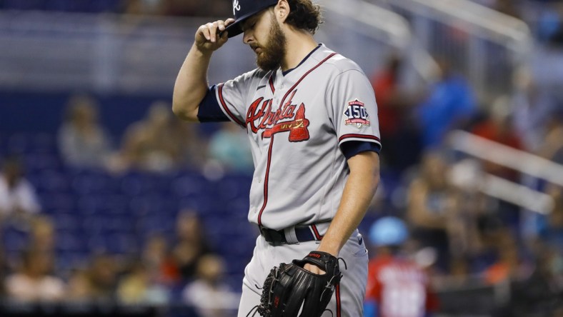 Jul 11, 2021; Miami, Florida, USA; Atlanta Braves starting pitcher Ian Anderson (36) reacts after the first inning against the Miami Marlins at loanDepot Park. Mandatory Credit: Sam Navarro-USA TODAY Sports