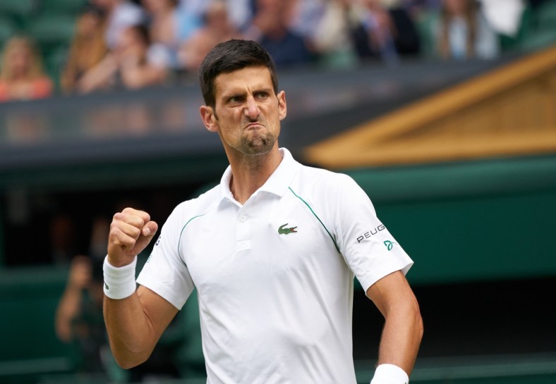 Jul 11, 2021; London, [ENTER STATE], United Kingdom;  Novak Djokovic (SRB) seen with a passionate expression while playing against Matteo Berrettini (ITA) in the men s final on Centre Court at All England Lawn Tennis and Croquet Club. Mandatory Credit: Peter van den Berg-USA TODAY Sports