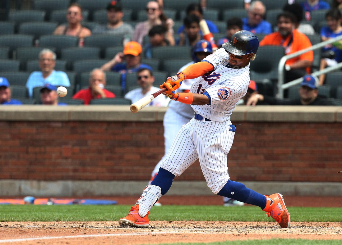 Jul 11, 2021; New York City, New York, USA; New York Mets shortstop Francisco Lindor (12) singles against the Pittsburgh Pirates during the fifth inning at Citi Field. Mandatory Credit: Andy Marlin-USA TODAY Sports