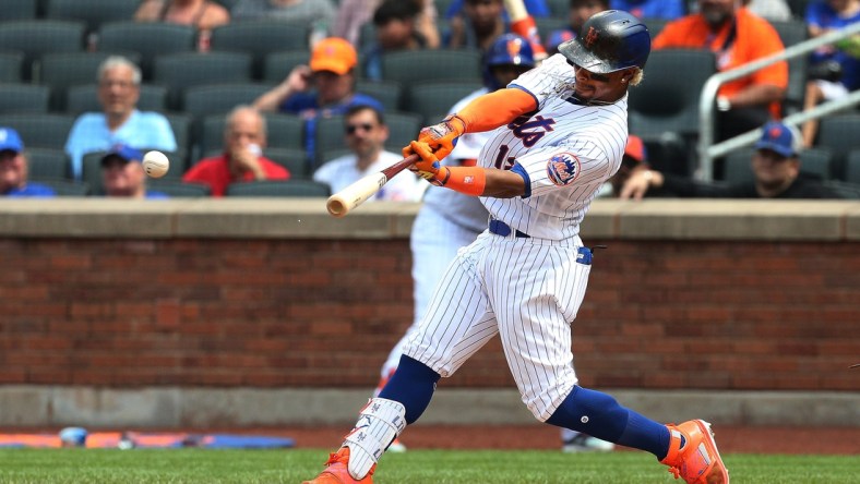 Jul 11, 2021; New York City, New York, USA; New York Mets shortstop Francisco Lindor (12) singles against the Pittsburgh Pirates during the fifth inning at Citi Field. Mandatory Credit: Andy Marlin-USA TODAY Sports