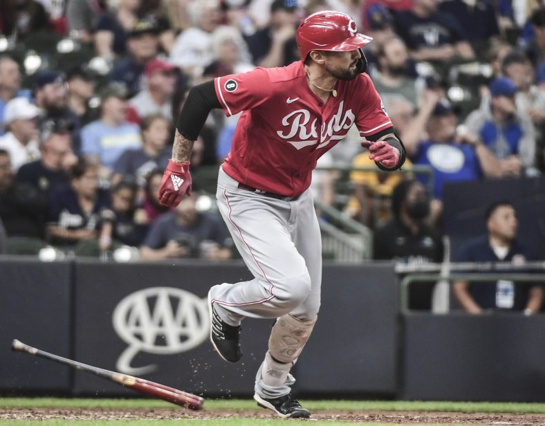 Jul 11, 2021; Milwaukee, Wisconsin, USA;  Cincinnati Reds right fielder Nick Castellanos (2) drives in 2 runs with a base hit in the ninth inning against the Milwaukee Brewers at American Family Field. Mandatory Credit: Benny Sieu-USA TODAY Sports