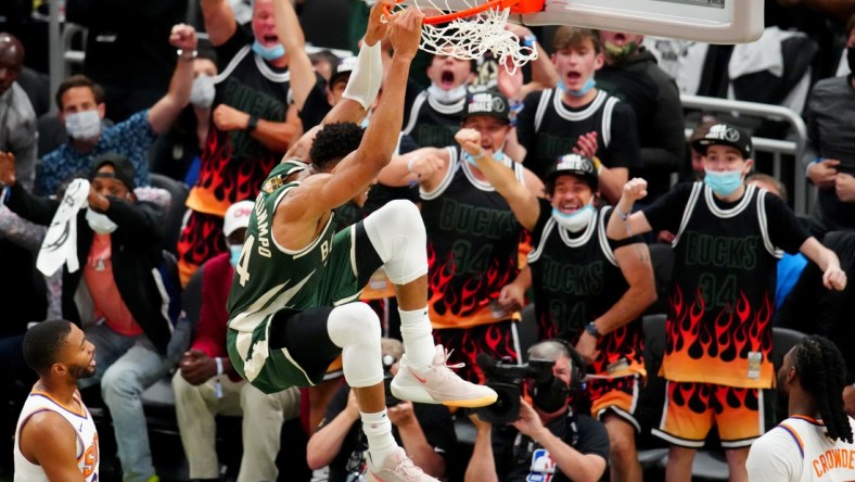 Jul 11, 2021; Milwaukee, Wisconsin, USA; Milwaukee Bucks forward Giannis Antetokounmpo (34) dunks against the Phoenix Suns during game three of the 2021 NBA Finals at Fiserv Forum. Mandatory Credit: Mark J. Rebilas-USA TODAY Sports