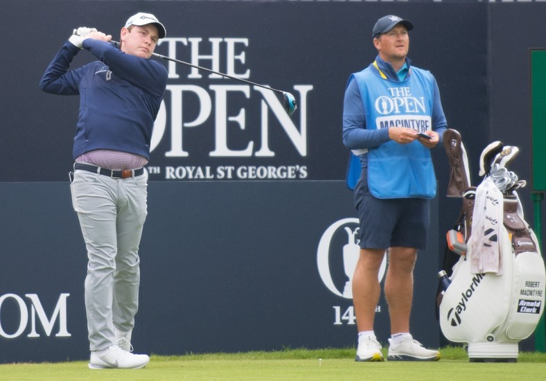 Jul 12, 2021; Sandwich, England, GBR; Robert MacIntyre of Scotland tees off during a practice round for the Open Championship golf tournament at Royal St. George's Golf Course. Mandatory Credit: Sandra Mailer-USA TODAY Sports