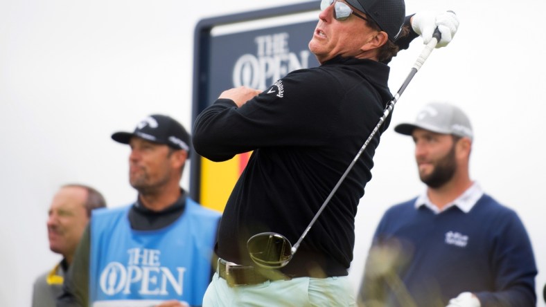 Jul 14, 2021; Sandwich, England, GBR; Phil Mickelson plays his shot from the tenth tee during a practice round for the Open Championship golf tournament at Royal St. George's Golf Course. Mandatory Credit: Sandra Mailer-USA TODAY Sports