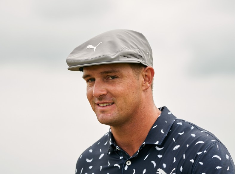 Jul 15, 2021; Sandwich, England, GBR; Bryson DeChambeau looks on from the thirteenth green during the first round of the Open Championship golf tournament. Mandatory Credit: Peter van den Berg-USA TODAY Sports