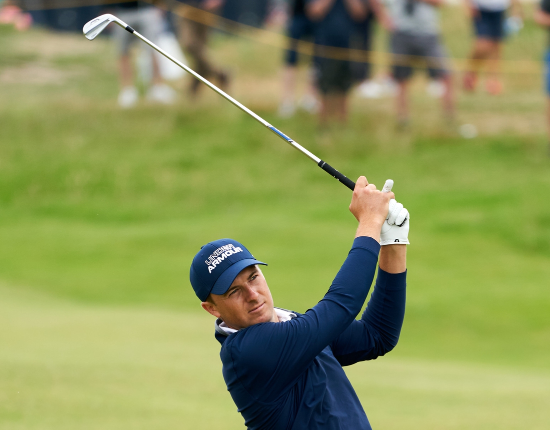 Jul 15, 2021; Sandwich, England, GBR; Jordan Spieth plays his shot from the thirteenth fairway during the first round of the Open Championship golf tournament. Mandatory Credit: Peter van den Berg-USA TODAY Sports