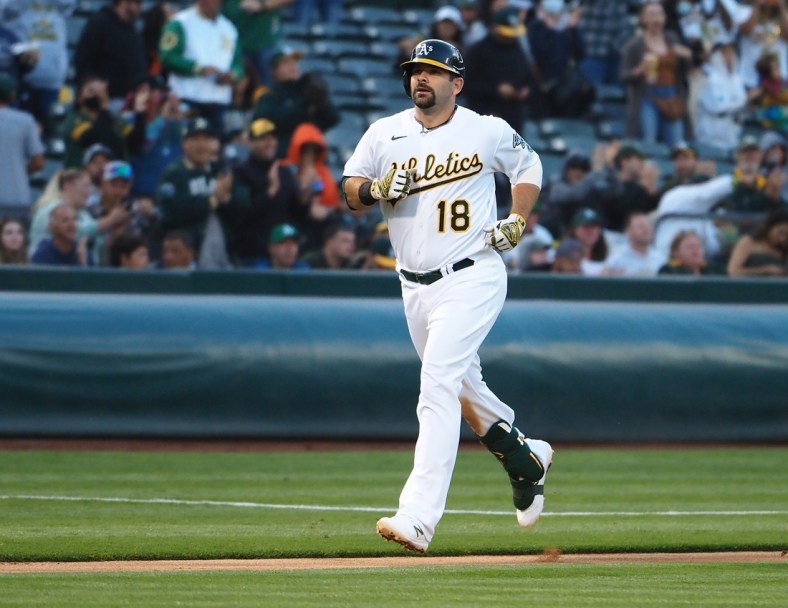 Jul 16, 2021; Oakland, California, USA; Oakland Athletics designated hitter Mitch Moreland (18) rounds the bases on a solo home run against the Cleveland Indians during the fourth inning at RingCentral Coliseum. Mandatory Credit: Kelley L Cox-USA TODAY Sports